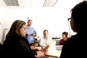 A group of people sitting at a table.