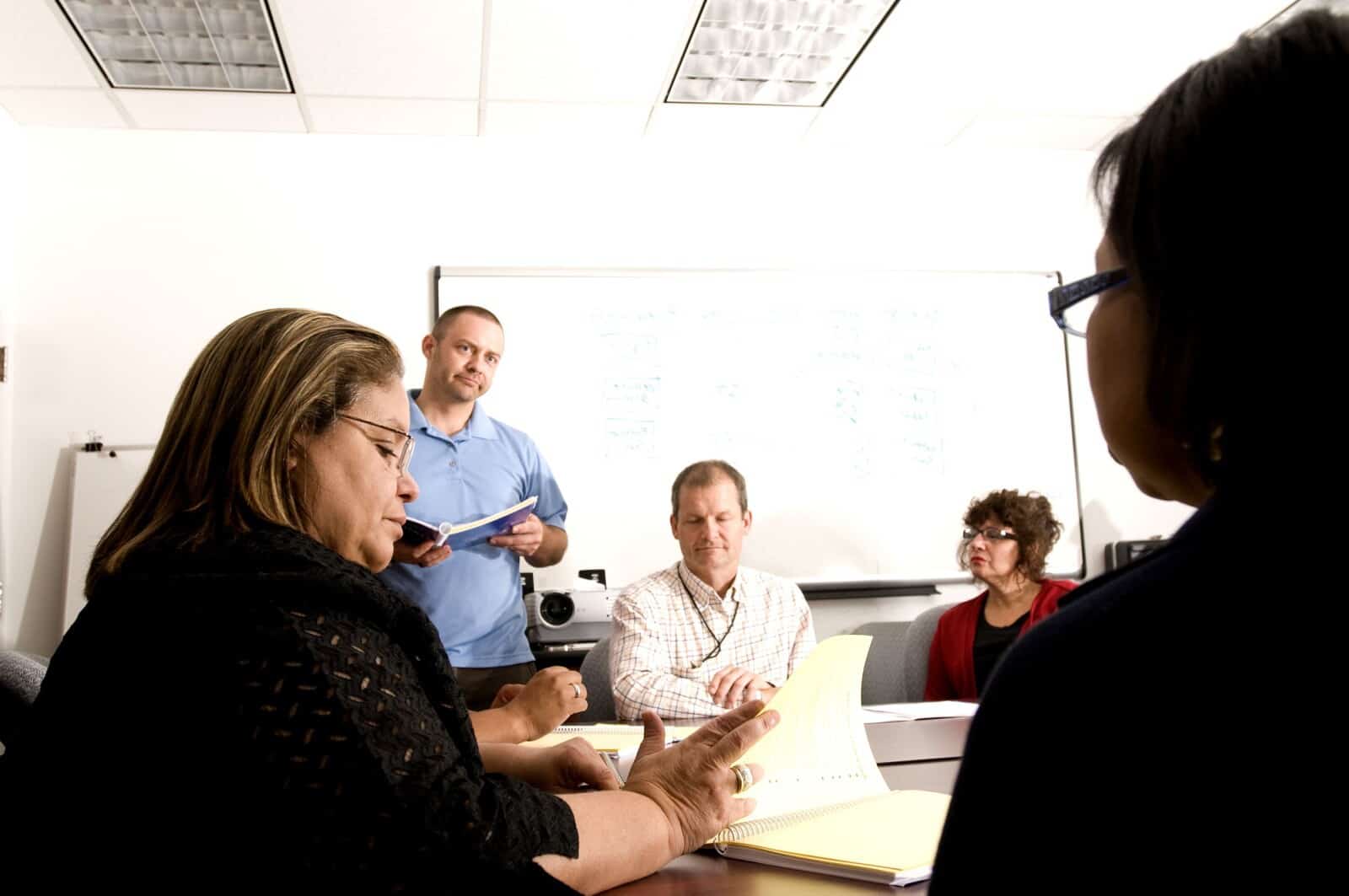 A group of people sitting at a table.