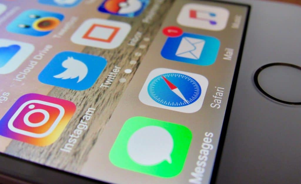 A close up of an iphone with various icons on it.